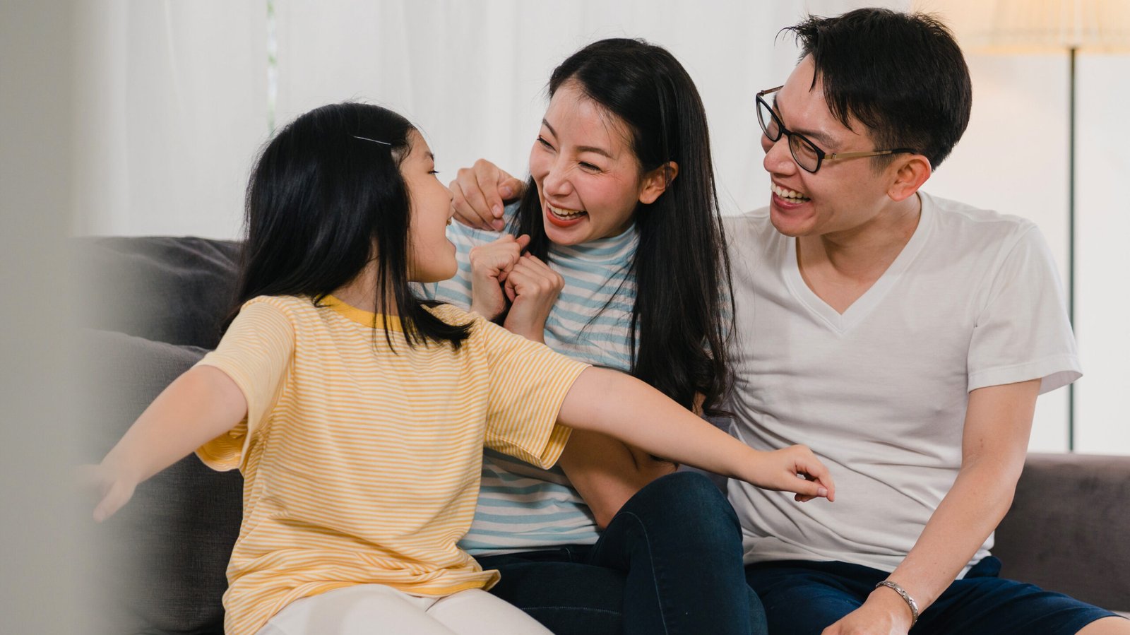 happy asian young family homeowners bought new house. japanese m